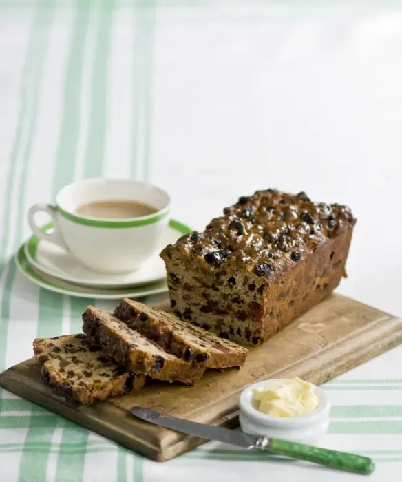 Framed Print : Traditional style fruit tea loaf sliced and served with butter and afternoon tea credit Framed Print : Traditional style fruit tea loaf sliced and served with butter and afternoon tea credit