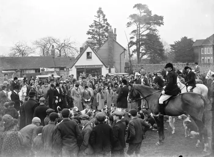 Framed Print : W. K. Hunt Crowds gather in the village of Offham, Kent for a foxhunt