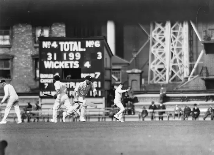 Framed Print : Warwickshire versus Surrey. Father and son at The Oval wicket. W G Quaife