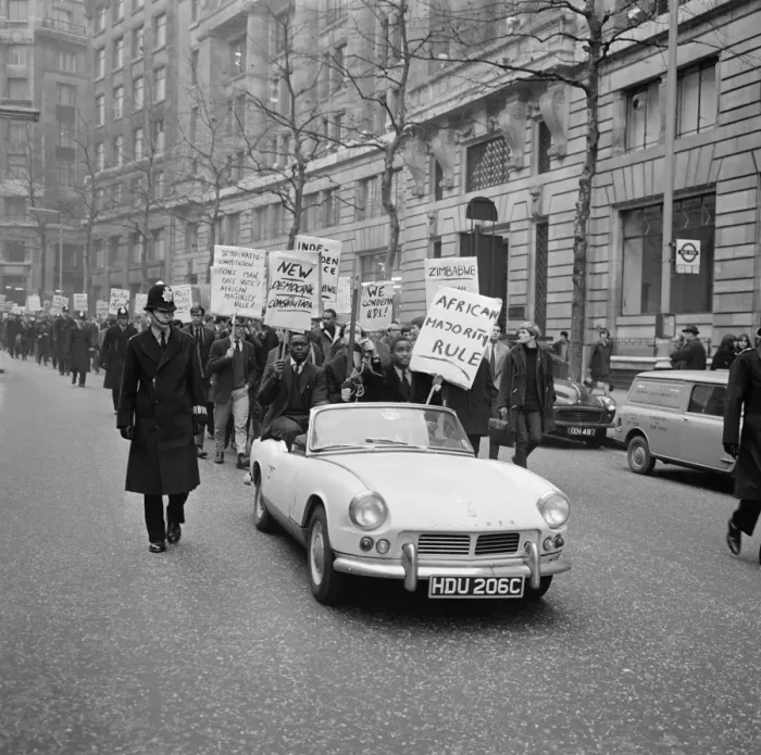 Framed Print : White and coloured students, displaying slogan carrying placards pictured during