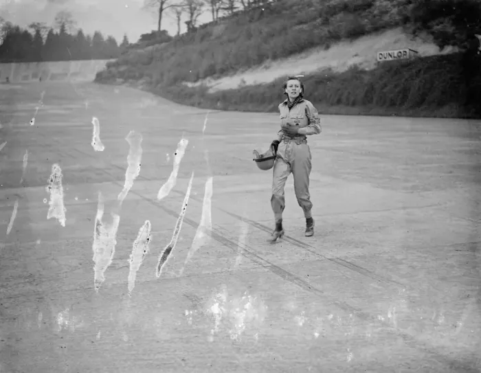 Framed Print : Woman driver leaps from blazing car at international trophy race. Miss Doreen Evans Framed Print : Woman driver leaps from blazing car at international trophy race. Miss Doreen Evans