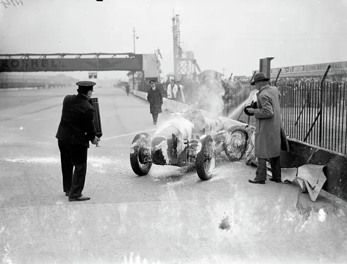 Framed Print : Woman driver leaps from blazing car at international trophy race. Miss Doreen Evans Framed Print : Woman driver leaps from blazing car at international trophy race. Miss Doreen Evans