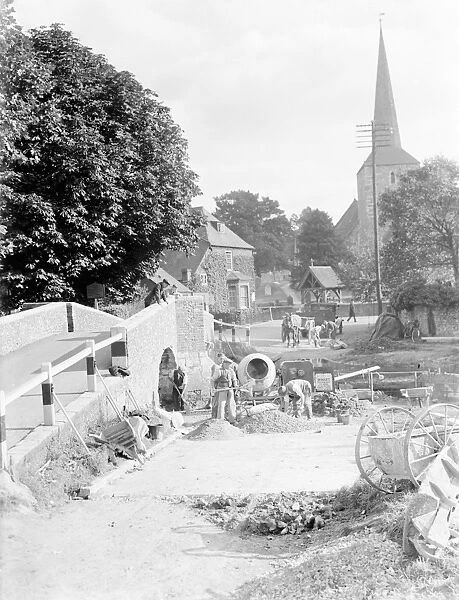 Workers building a ford water crossing by the Eynsford bridge over the River Darent