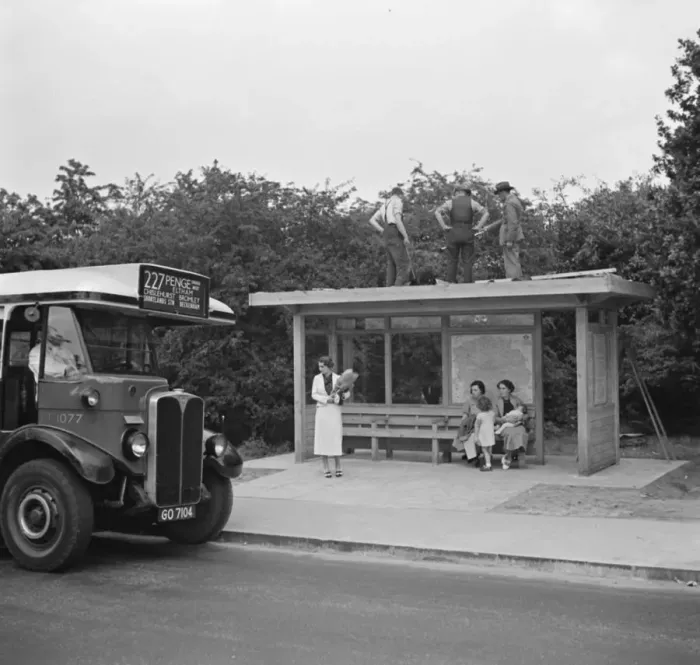 Framed Print : Workers on top of a bus shelter in Chislehurst, Kent. 1936