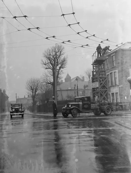 Framed Print : Workers from the Demolition and Construction Company Ltd use their Bedford Tram Tower Framed Print : Workers from the Demolition and Construction Company Ltd use their Bedford Tram Tower