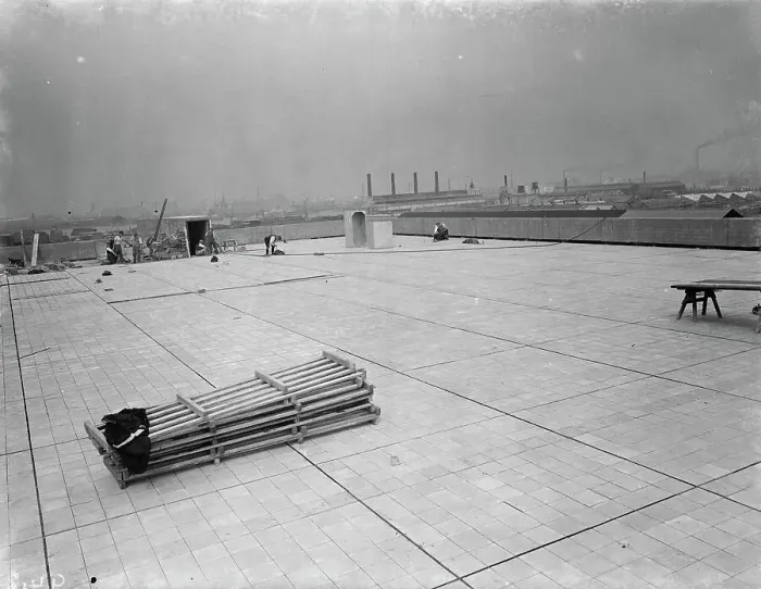 Framed Print : Workers from Val De Travers Asphalt Limited, a paving company, working on a roof in Greenwich Framed Print : Workers from Val De Travers Asphalt Limited, a paving company, working on a roof in Greenwich
