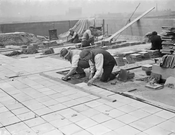 Framed Print : Workers from Val De Travers Asphalt Limited, a paving company, working on a roof in Greenwich Framed Print : Workers from Val De Travers Asphalt Limited, a paving company, working on a roof in Greenwich