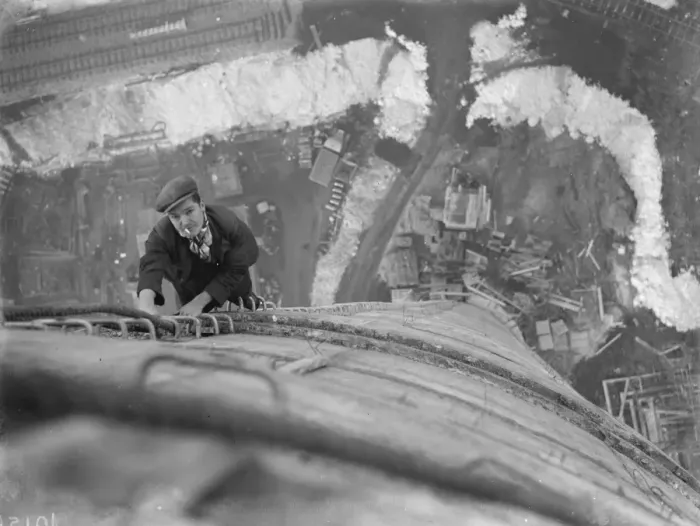 Framed Print : A workman climbs up on of the chimneys of the new coal electric power station under Framed Print : A workman climbs up on of the chimneys of the new coal electric power station under