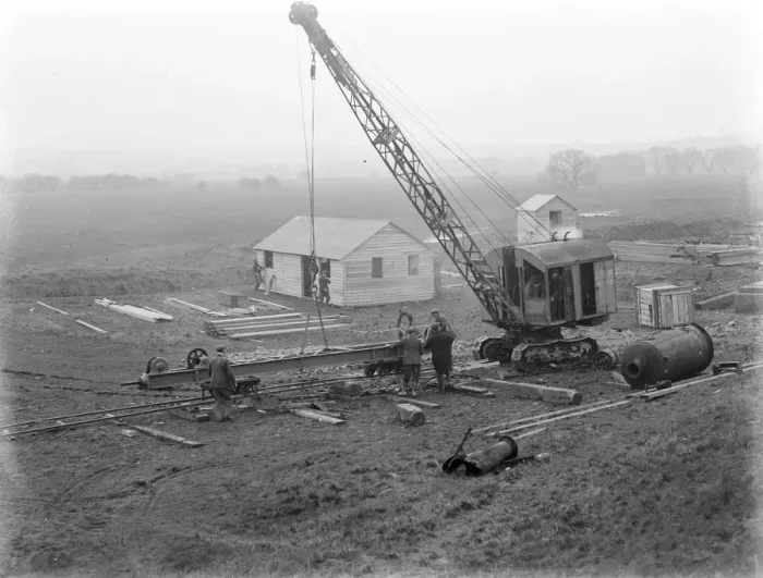 Framed Print : Workmen using a crane for the construction of the Dartford Tunnel. Work begins Framed Print : Workmen using a crane for the construction of the Dartford Tunnel. Work begins