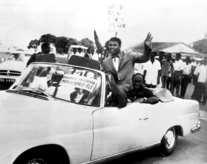 Framed Print : World Heavyweight Boxing Champion Cassius Clay rides in an open sports car as he