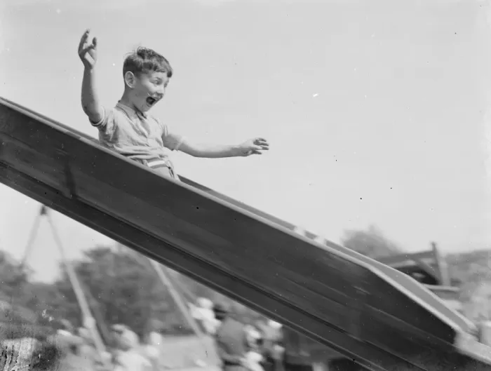 Framed Print : A young boy on a slide in Dartford, Kent. 1939 Framed Print : A young boy on a slide in Dartford, Kent. 1939