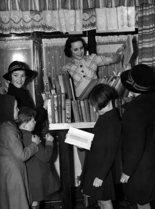 Framed Print : Young girl running a lending library for other schoolchildren. 1940 s Framed Print : Young girl running a lending library for other schoolchildren. 1940 s