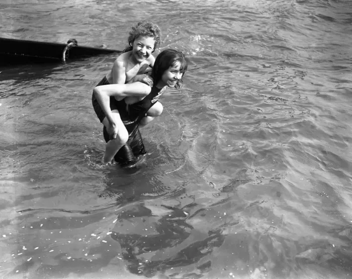 Framed Print : Young holiday makers enjoy a pick- a - back in the sea at Southend. 6 April 1920