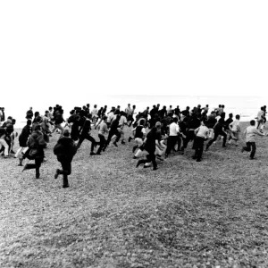 1964. Hastings. Mods and Rockers clash. 3rd August. Racing along the beach 1964. Hastings. Mods and Rockers clash. 3rd August. Racing along the beach