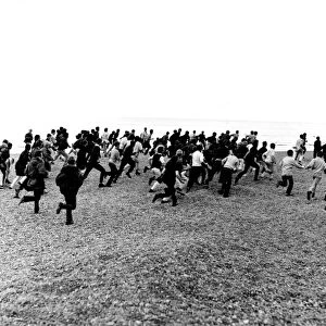 1964. Hastings. Mods and Rockers clash. 3rd August. Racing along the beach