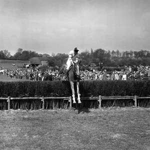 9 May 1954 Gay Kindersley takes the last on Huckster to win the Masters Cup event at the Old Surrey and Burstow Hunt point-to-point races at Spitals Cross, Edenbridge, Kent, England. TopFoto.co.uk 9 May 1954 Gay Kindersley takes the last on Huckster to win the Masters Cup event at the Old Surrey and Burstow Hunt point-to-point races at Spitals Cross, Edenbridge, Kent, England. TopFoto.co.uk
