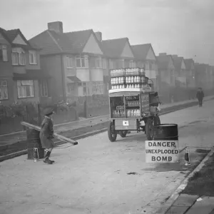 Print of a milkman navigating past an unexploded bomb in Sidcup, Kent