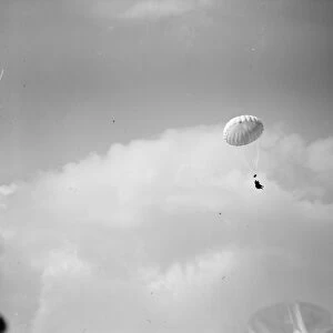 Aerial Derby at Hendon on July 5th Parachutist hanging from their chute 21 June 1919