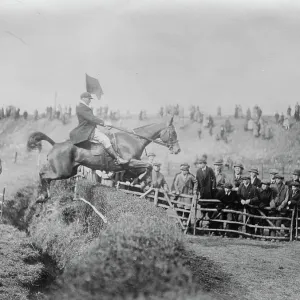 Bar Point to Point Races at Edenbridge Judge Farrant on his horse Thornton Le Moor taking the last fence before winning the bar heavy weight race 1922 Bar Point to Point Races at Edenbridge Judge Farrant on his horse Thornton Le Moor taking the last fence before winning the bar heavy weight race 1922