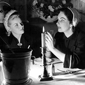 Betty Whelan (left) and Dorothy Flynn, young Irish beauties dining by candlelight