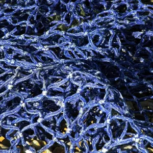 Detail of blue fishing net in the sunshine credit: Marie-Louise Avery / thePictureKitchen Detail of blue fishing net in the sunshine credit: Marie-Louise Avery / thePictureKitchen