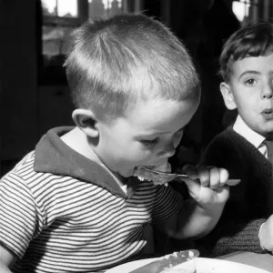 Bobby Mitchell, age 5 during lunch at Melcombe Infants School, Fulham Palace Road, London