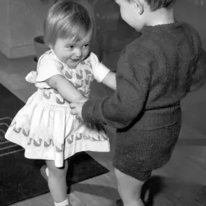 Boy and girl toddlers playing together dancing partners dance / dancing / party season Boy and girl toddlers playing together dancing partners dance / dancing / party season