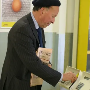 Business man entering a building using a swipe card. ?TopFoto Business man entering a building using a swipe card. ?TopFoto