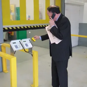 Business man entering a building using a swipe card. ?TopFoto Business man entering a building using a swipe card. ?TopFoto
