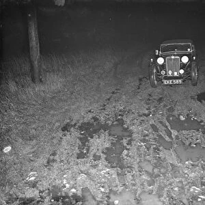 A car driving down Church Road in Kingsdown, Kent. 12 December 1938