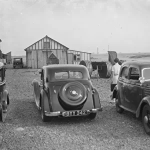 Cars parked on the Dungeness beach in Kent. 1936