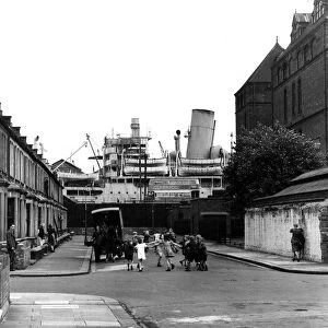 Children playing in dock side street, Silvertown, London, England 1946