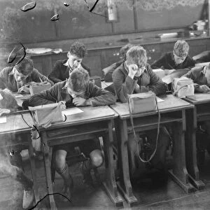 Children at school in Sidcup, Kent, during wartime. Here they are in a lesson