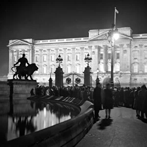 Crowds gather outside floodlight Palace on eve of Royal Wedding. 19 November 1947