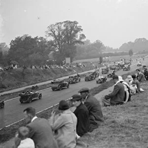 Crowds watching the traffic passing on the on newly opened Sidcup by - pass