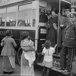 Derby Day Mrs Asquith and her party arriving by a St Dunstans motor bus, are