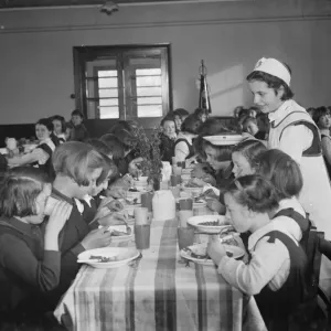 1937 Print of a Dinner Lady Serving Lunch at an Orpington Girls School 1937 Print of a Dinner Lady Serving Lunch at an Orpington Girls School