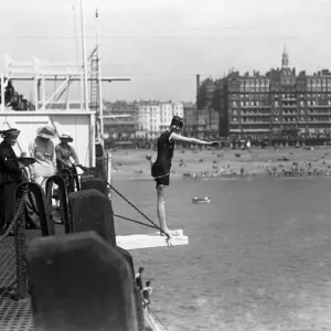 Diving off the pier during the Whitsun holiday at Brighton. 1920 Diving off the pier during the Whitsun holiday at Brighton. 1920