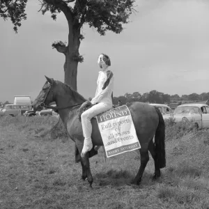 Print of a 1960 photograph showing a girl in fancy dress with her pony Print of a 1960 photograph showing a girl in fancy dress with her pony