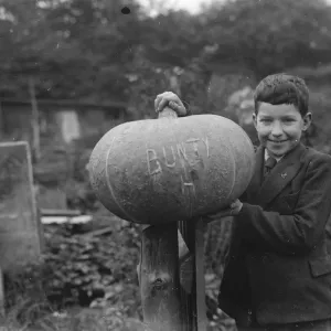 Edward Harrison from North Cray, Kent, poses with the pumpkin that he grew. 1938 Edward Harrison from North Cray, Kent, poses with the pumpkin that he grew. 1938