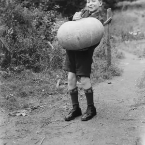 Edward Harrison from North Cray, Kent, poses with the pumpkin that he grew. 1938 Edward Harrison from North Cray, Kent, poses with the pumpkin that he grew. 1938