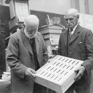 Black and white print of an elderly beekeeper
