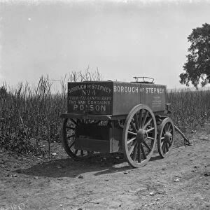 Farmers disinfectant trailer from borough of Stepney at the side of a field