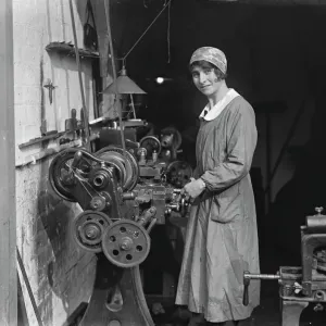 Black and white photograph print of a woman working on a lathe Black and white photograph print of a woman working on a lathe