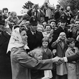 Forest Row, Sussex : A local housewife shakes hands with US President John Kennedy