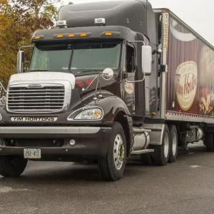 A freightliner 6x4 artic unit, hauling for the Canadian icon, Tim Hortons coffee