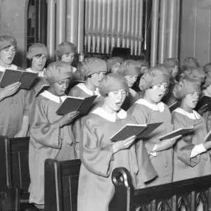 Girl choristers at Dr Barnardos homes, Berkingside, practising christmas carols Girl choristers at Dr Barnardos homes, Berkingside, practising christmas carols