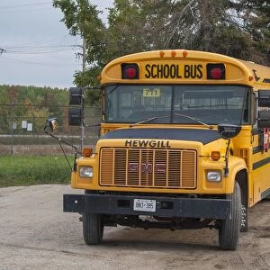 GMC yellow school bus, parked up at its home depot