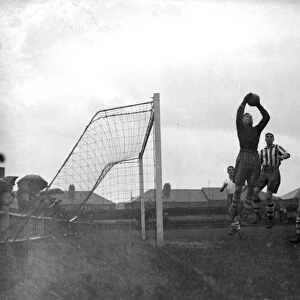 The goalkeeper makes a save at the Dartford V Enfield football match. 10 November 1934