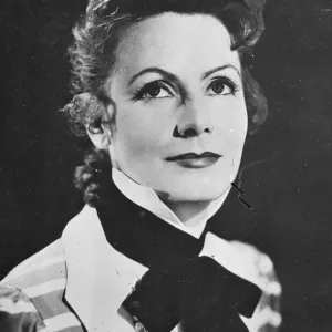 Greta Garbos new hairstyle, in which curls have taken the place of the almost severe Greta Garbos new hairstyle, in which curls have taken the place of the almost severe
